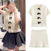 Women's suit New Spring 2025 Black bow trim White knitted long-sleeved jacket Mini skirt Celebrity style Elegant